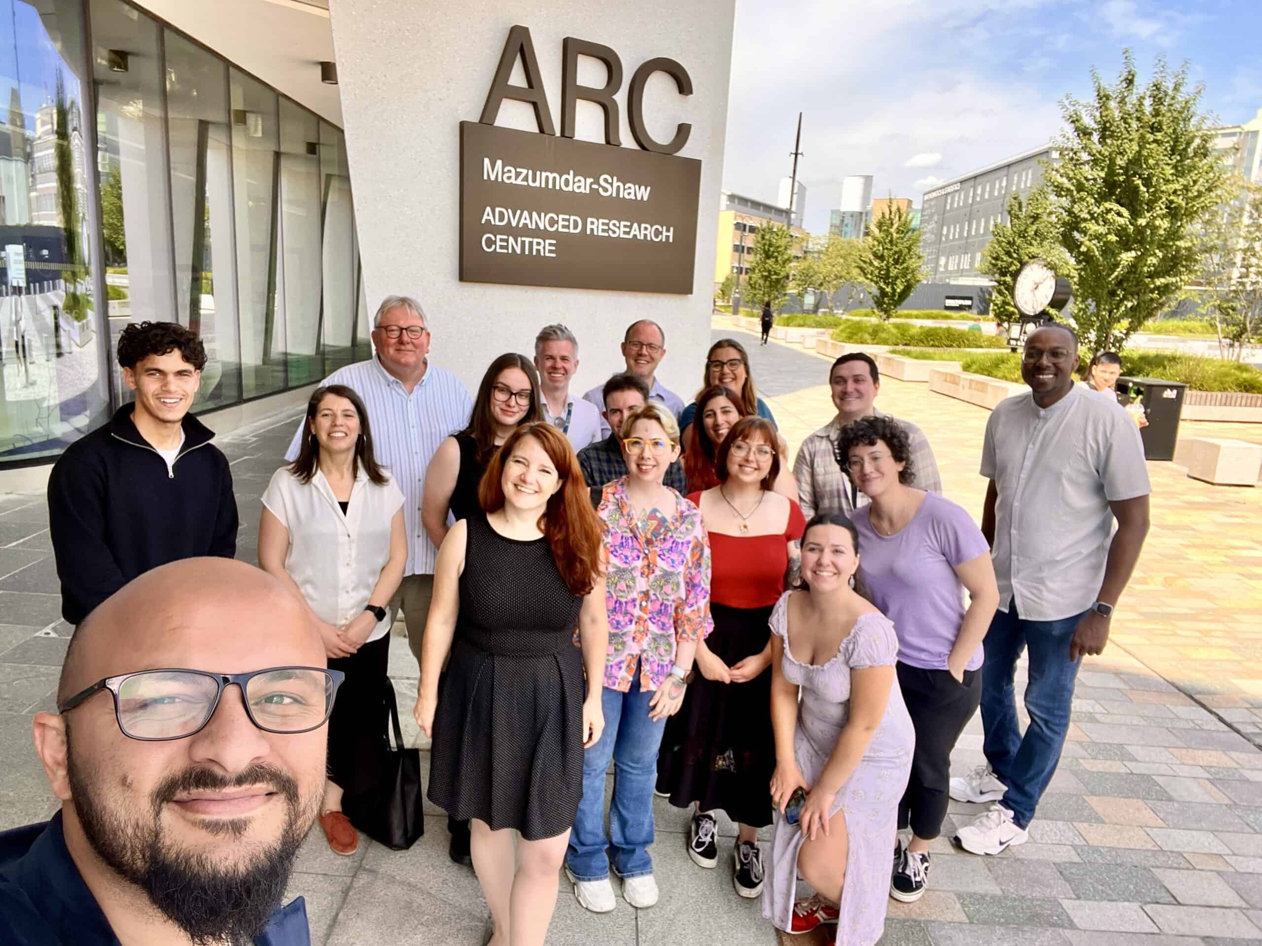 DiveIn team selfie in front of the ARC