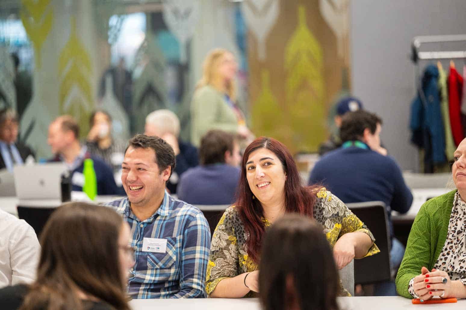 Silvia Mourão (DiveIn PGR - Cohort 1) and Paul Eizenhoefer (DiveIn Supervisor) smiling at the Annual Industry Showcase 2025