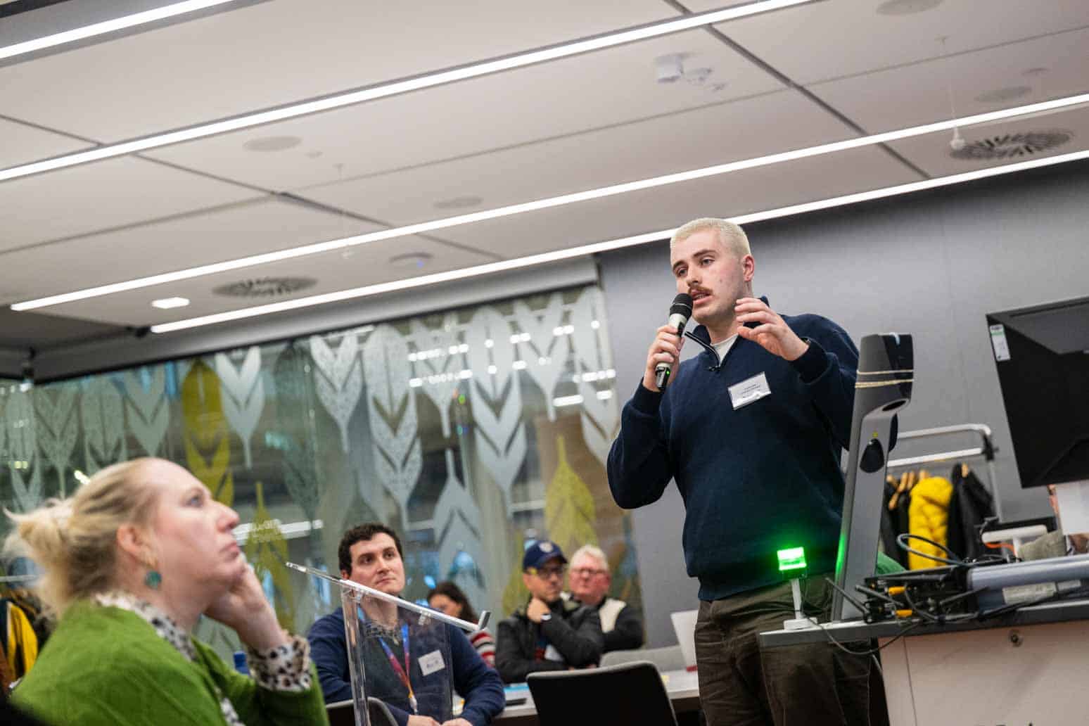 Andrew Reid (DiveIn PGR - Cohort 1) presenting his research poster at the Annual Industry Showcase 2025