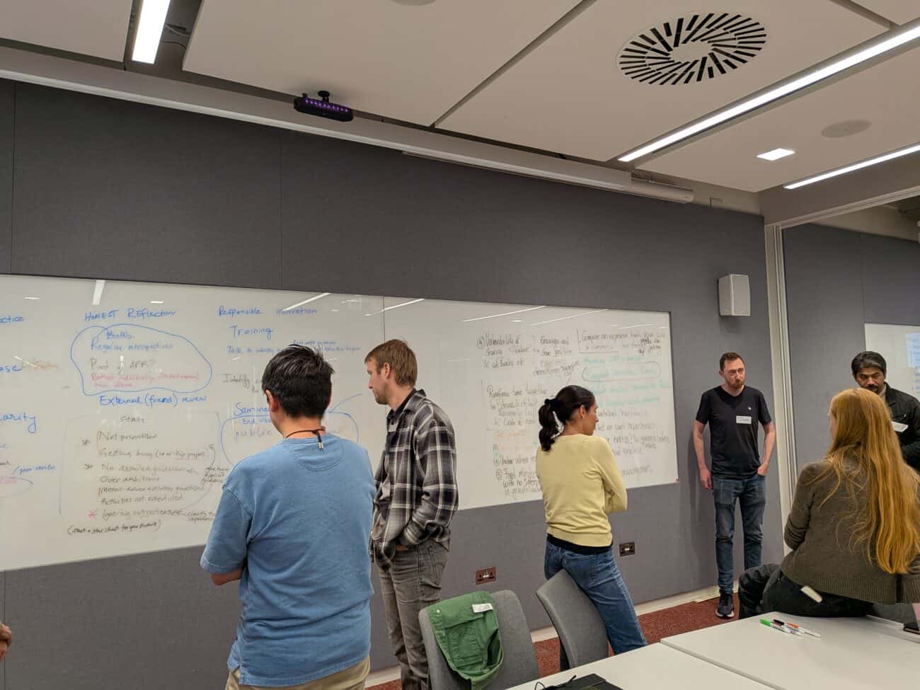 Attendees in discussion during the Build to Trust workshop session.